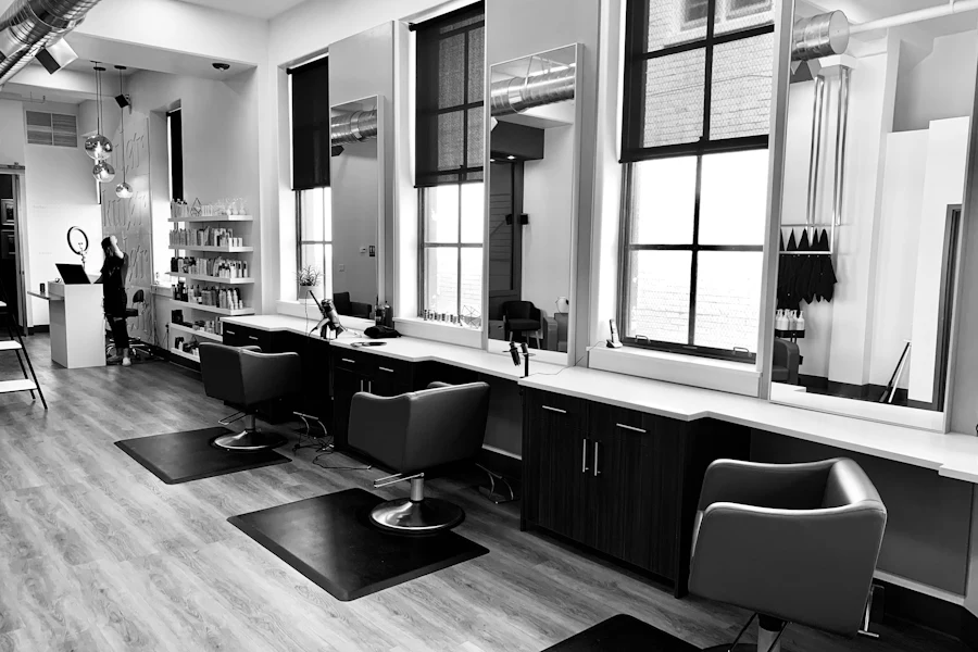 Illustrative black and white salon interior with styling chairs
